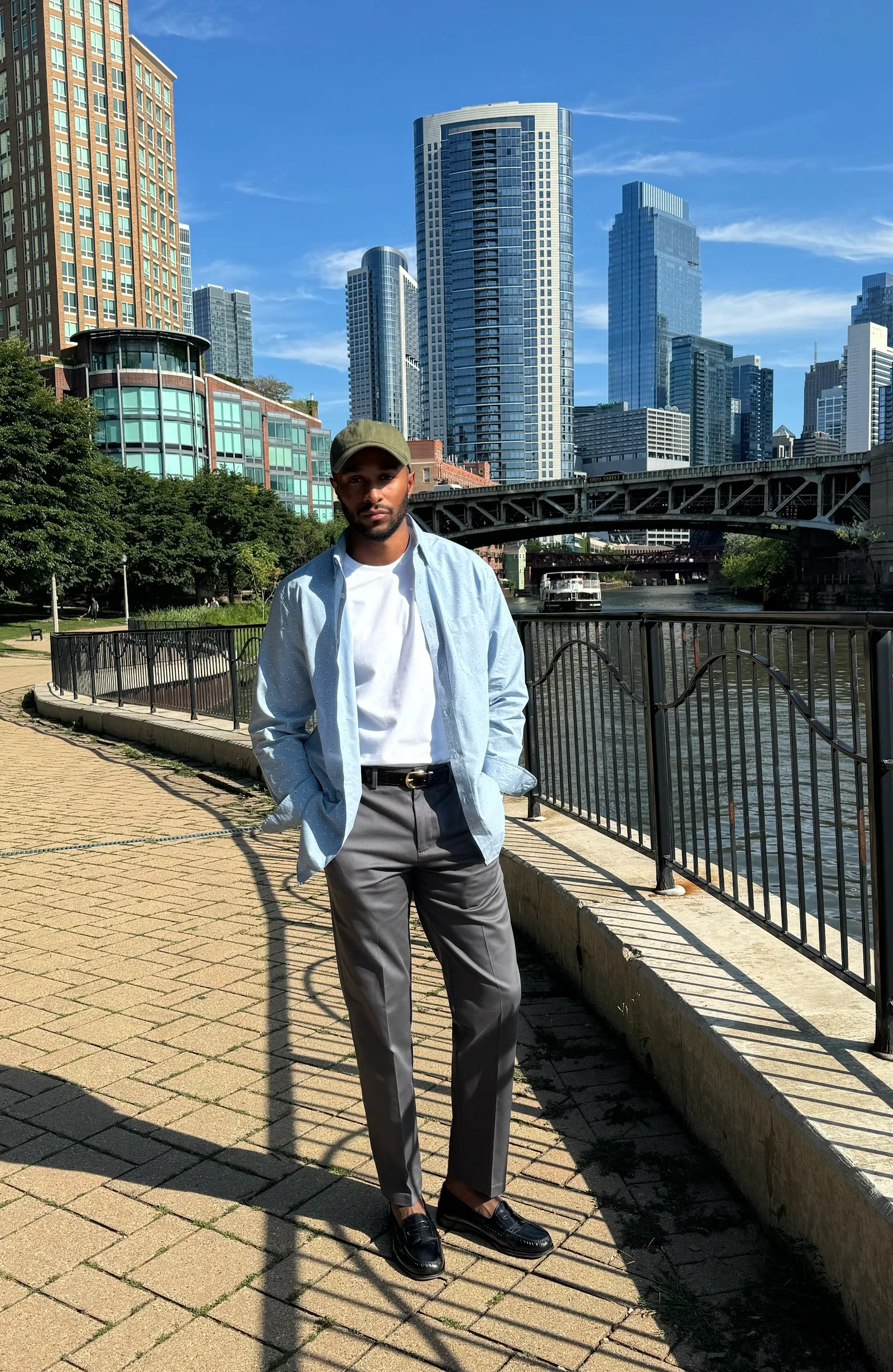Instagram Influencer Marketing Agency 49 Influencer in Haggar fall styling beside a city river and skyline