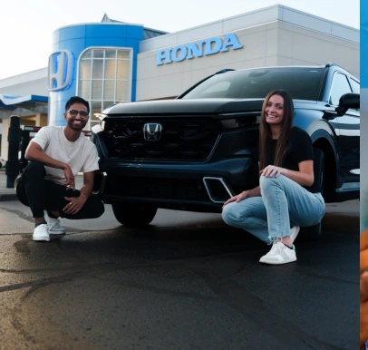 TikTok Influencer Marketing Agency 51 Two creators with a Honda SUV at a Honda dealership
